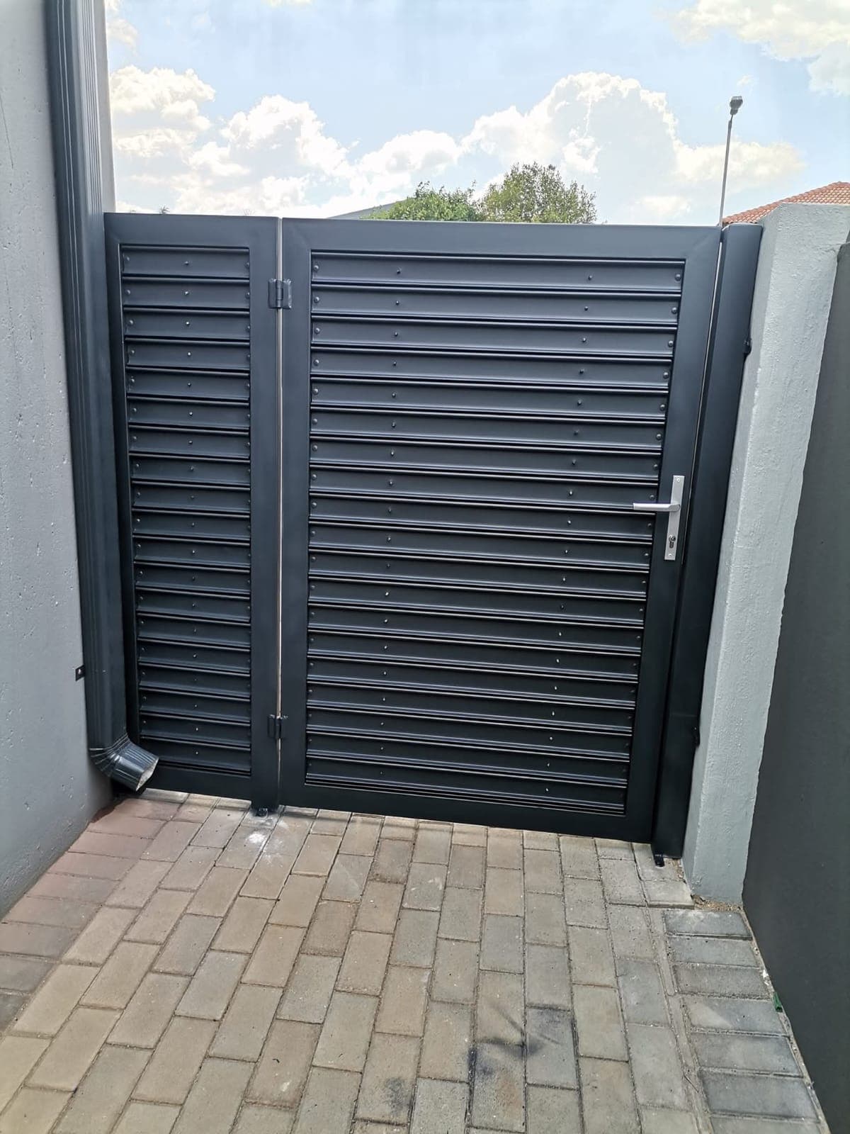 Pedestrian perforated slats gate